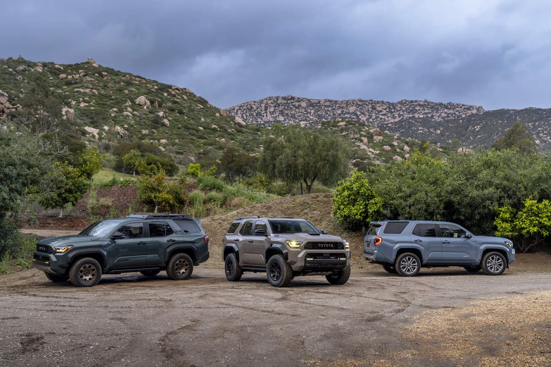 2025 Toyota 4Runner Trailhunter, TRD Pro, and Limited parked together on dirt