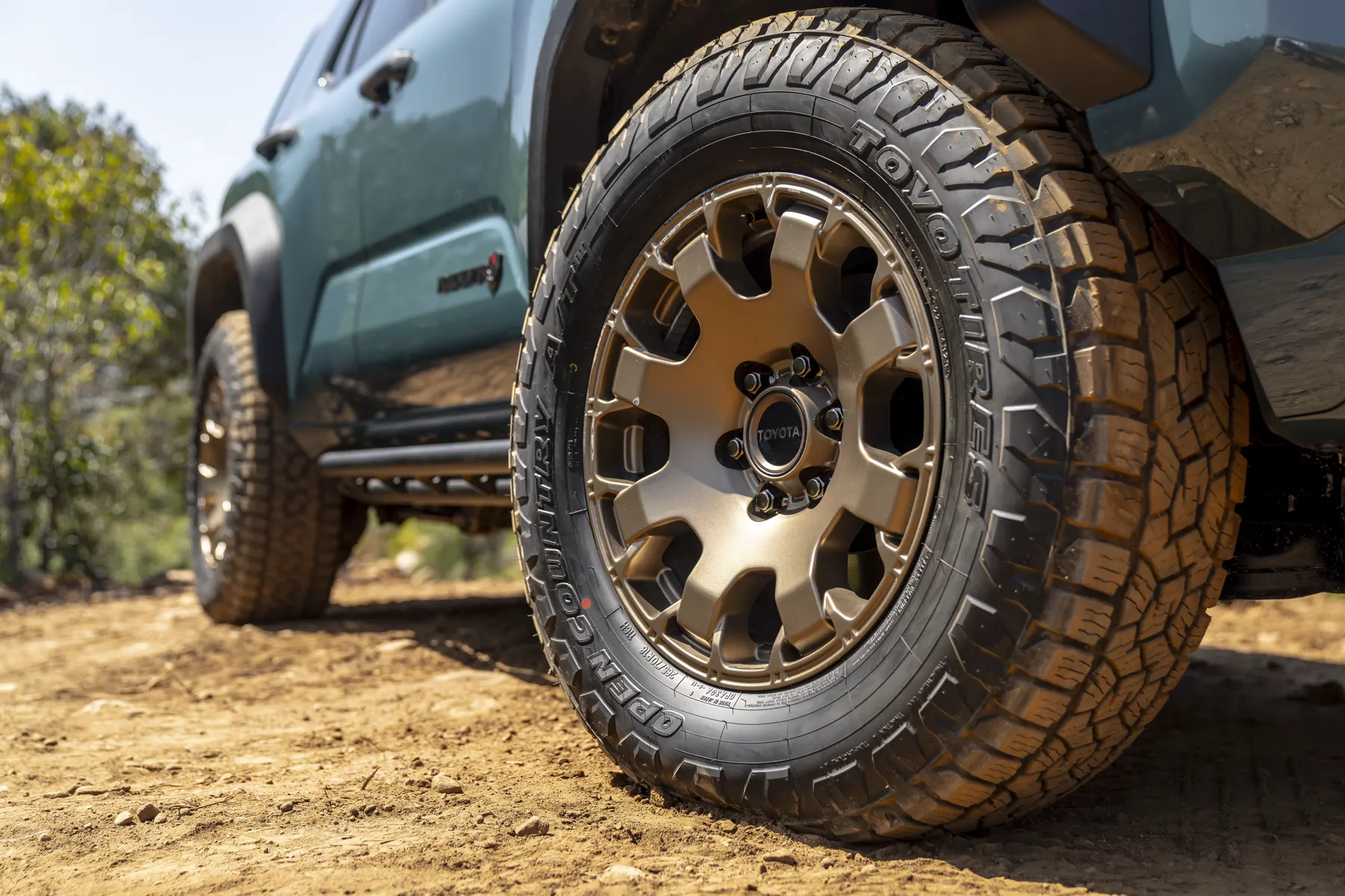 Bronze Trailhunter wheel, Toyo Open Country tire, and Trailhunter door badge