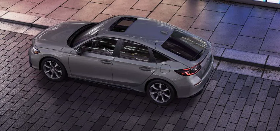 2025 Honda Civic Hatchback Sport Touring Hybrid from above, glass, roof, and wheels
