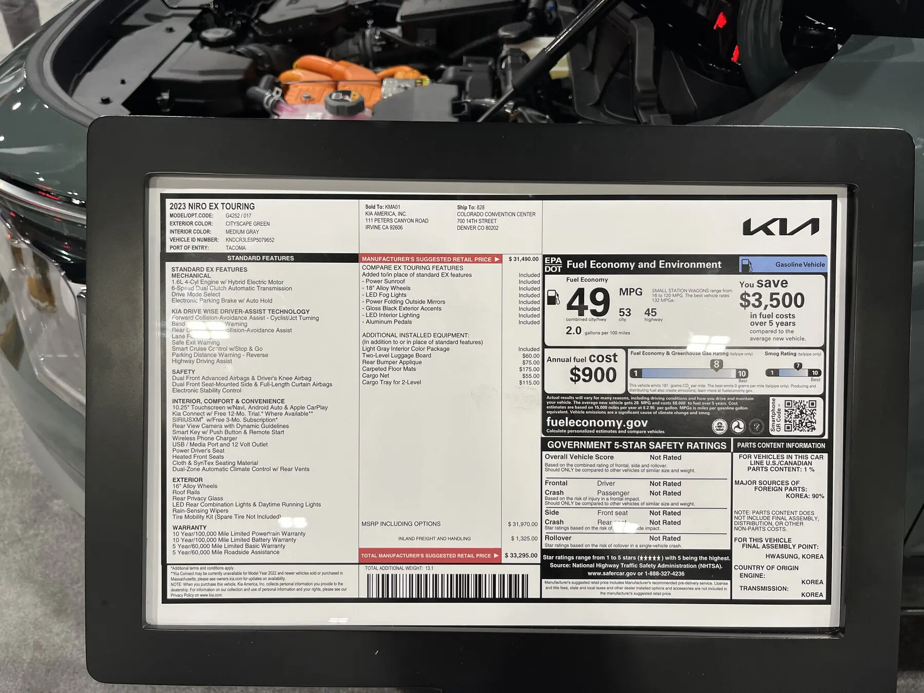 2023 Kia Niro EX Touring window sticker with MSRP columns and a 49 mpg EPA block