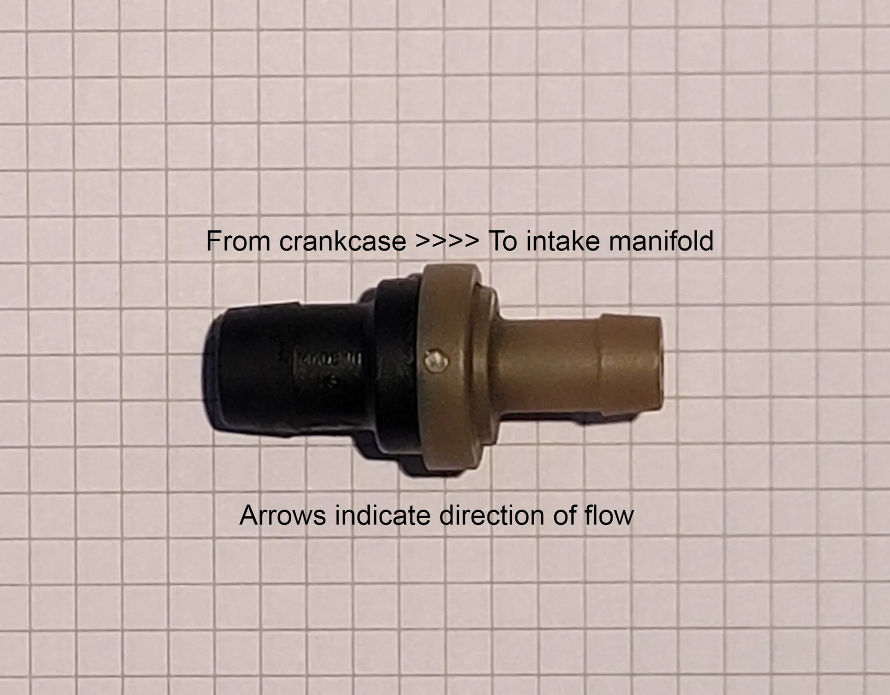 Cutaway PCV valve showing blow-by flowing through the pintle