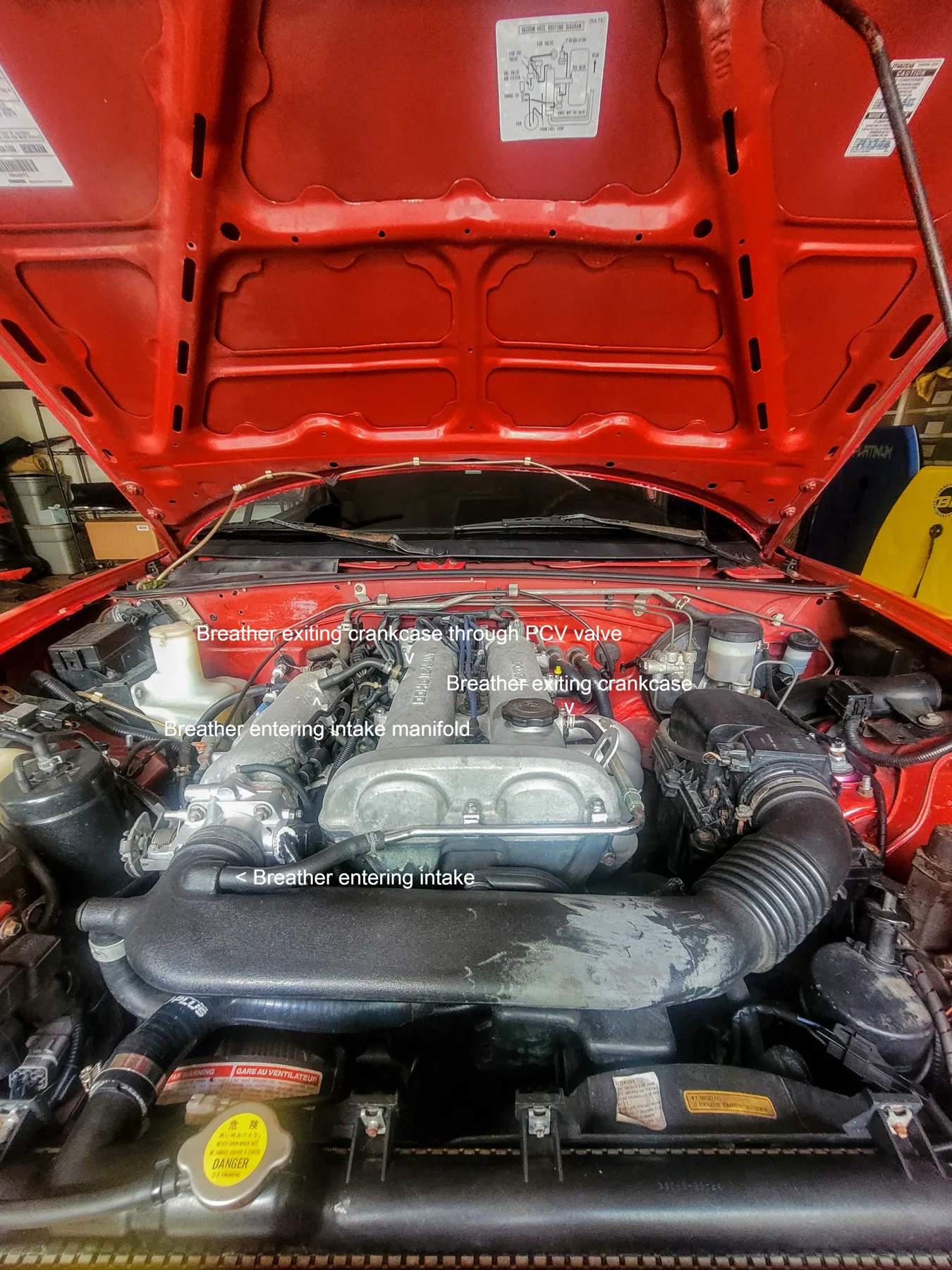 PCV hose and valve on a Mazda Miata valve cover