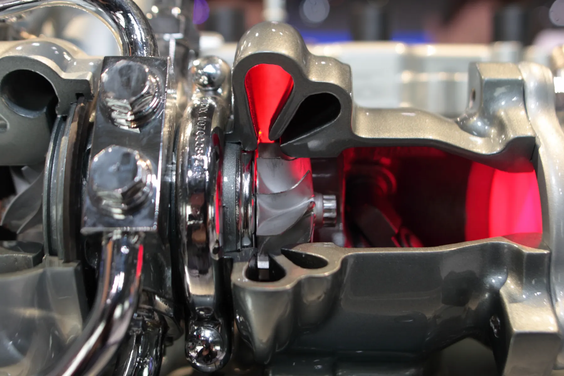 Twin-scroll turbine housing cutaway with the wastegate flap beside the wheel